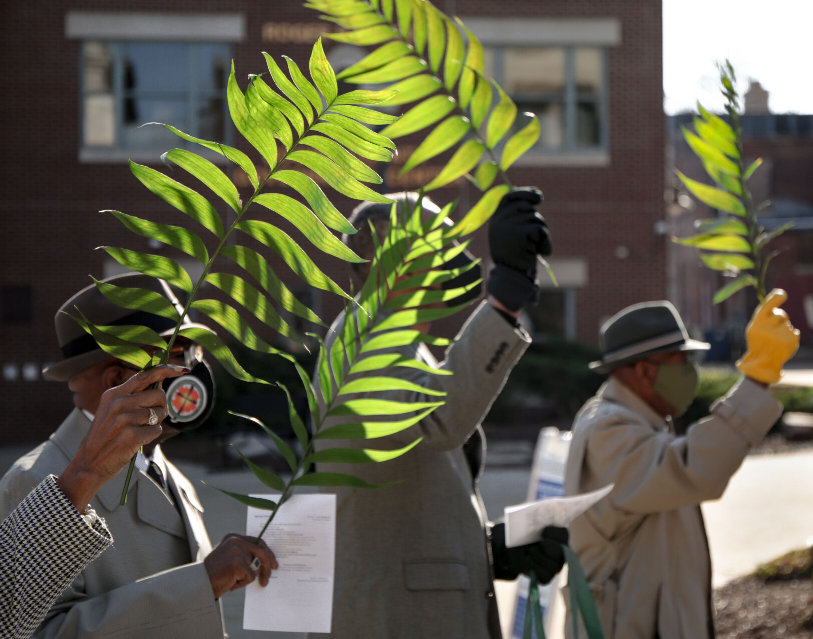 Members of the Second Missionary Baptist Church wave their palm fronds